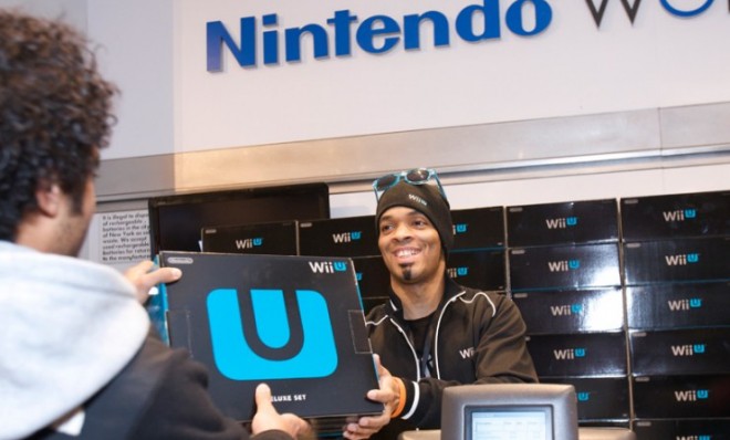 A man snaps up one of the first available Wii U systems at a midnight launch party in New York on Nov. 18.