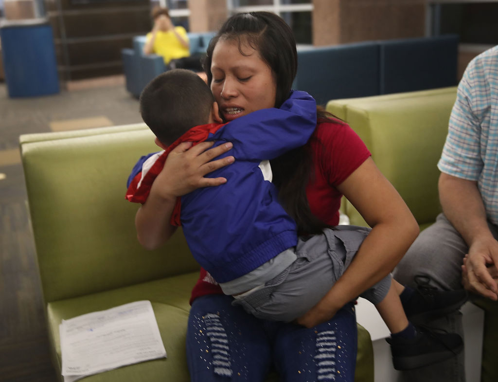  A woman, identified only as Maria, is reunited with her son Franco, 4, at the El Paso International Airport on July 26, 2018 in El Paso, Texas. 