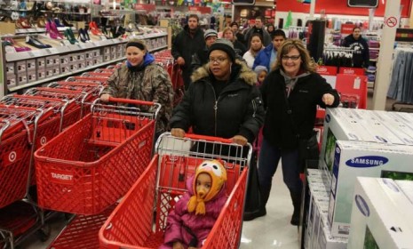 Shoppers enter an Indiana Target on Thanksgiving night, hoping to get a head start on their Black Friday shopping.