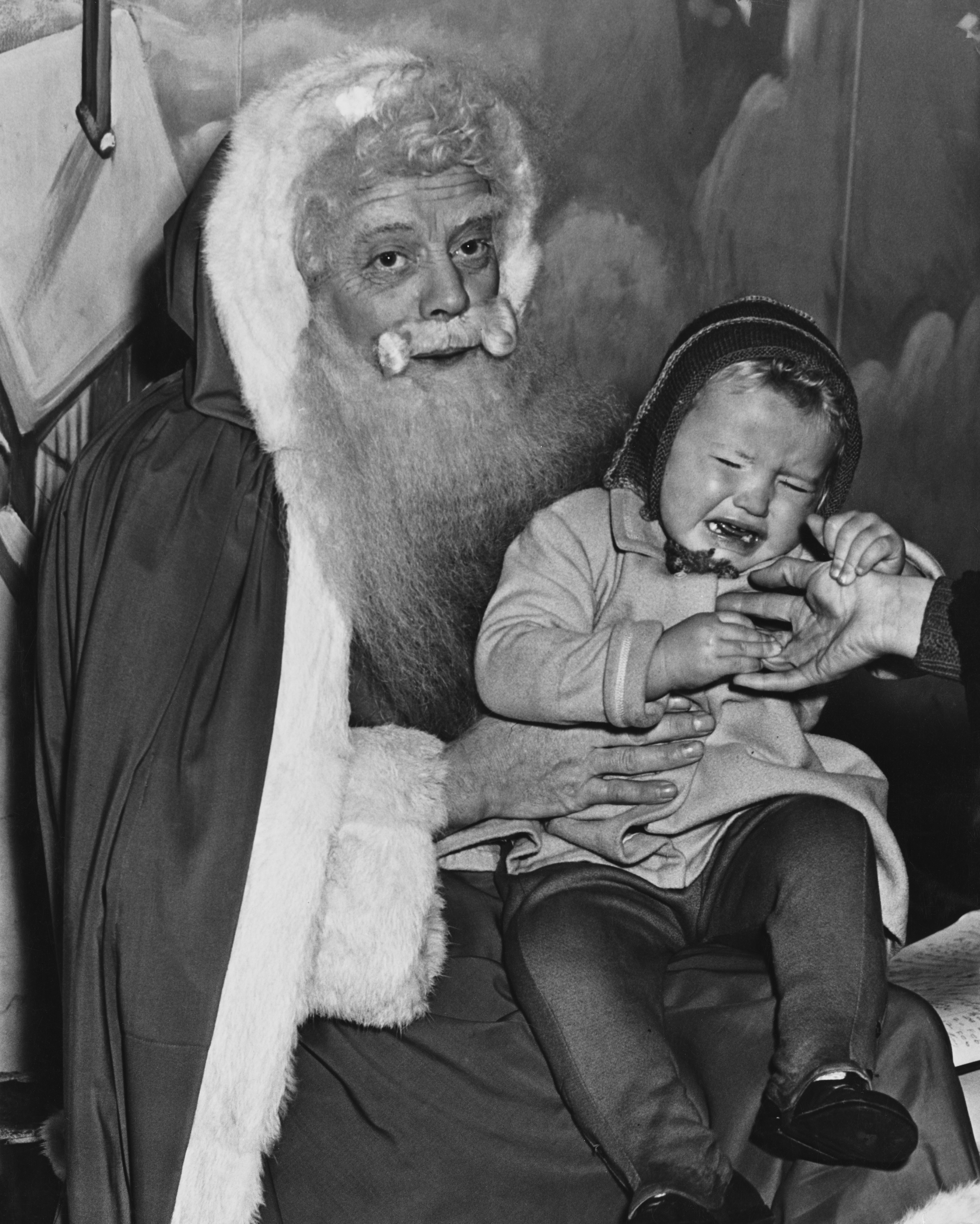 A baby who does not like Santa. 