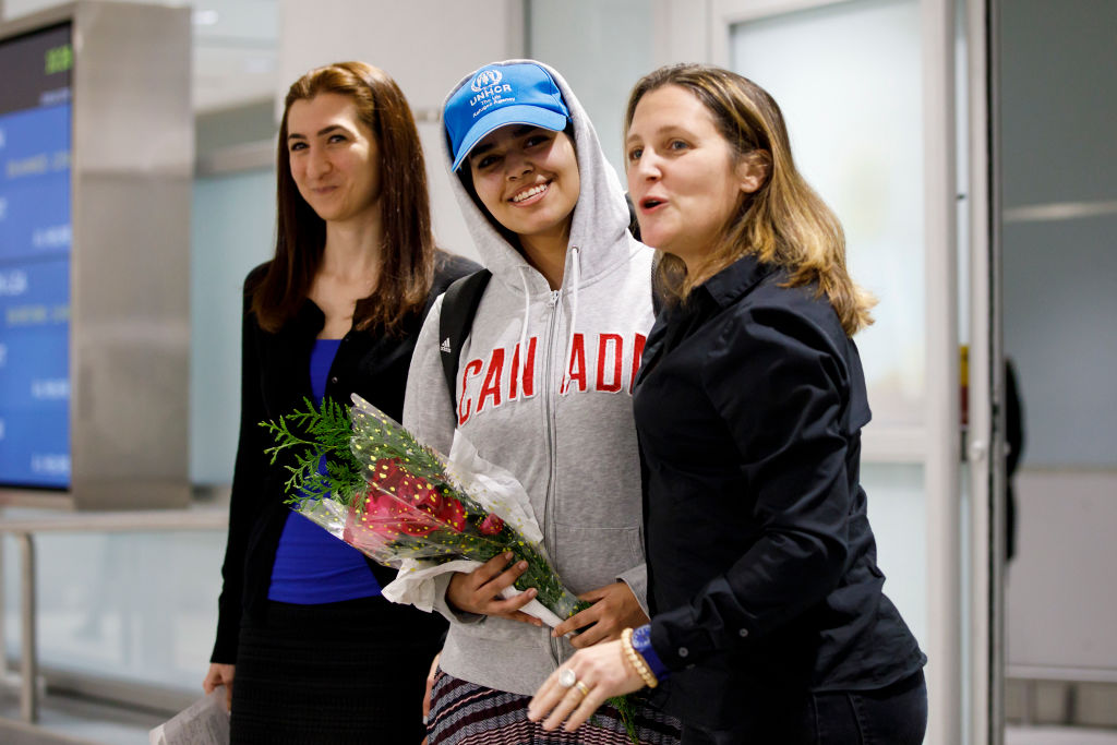 Asylum Seeker Rahaf Mohammed Al-Qunun, 18, smiles as she is introduced to the media at Toronto Pearson International Airport.