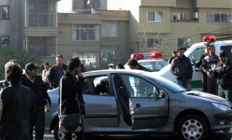 Police in Tehran examine a vehicle reportedly belonging to the Iranian nuclear scientist killed in a bomb attack.
