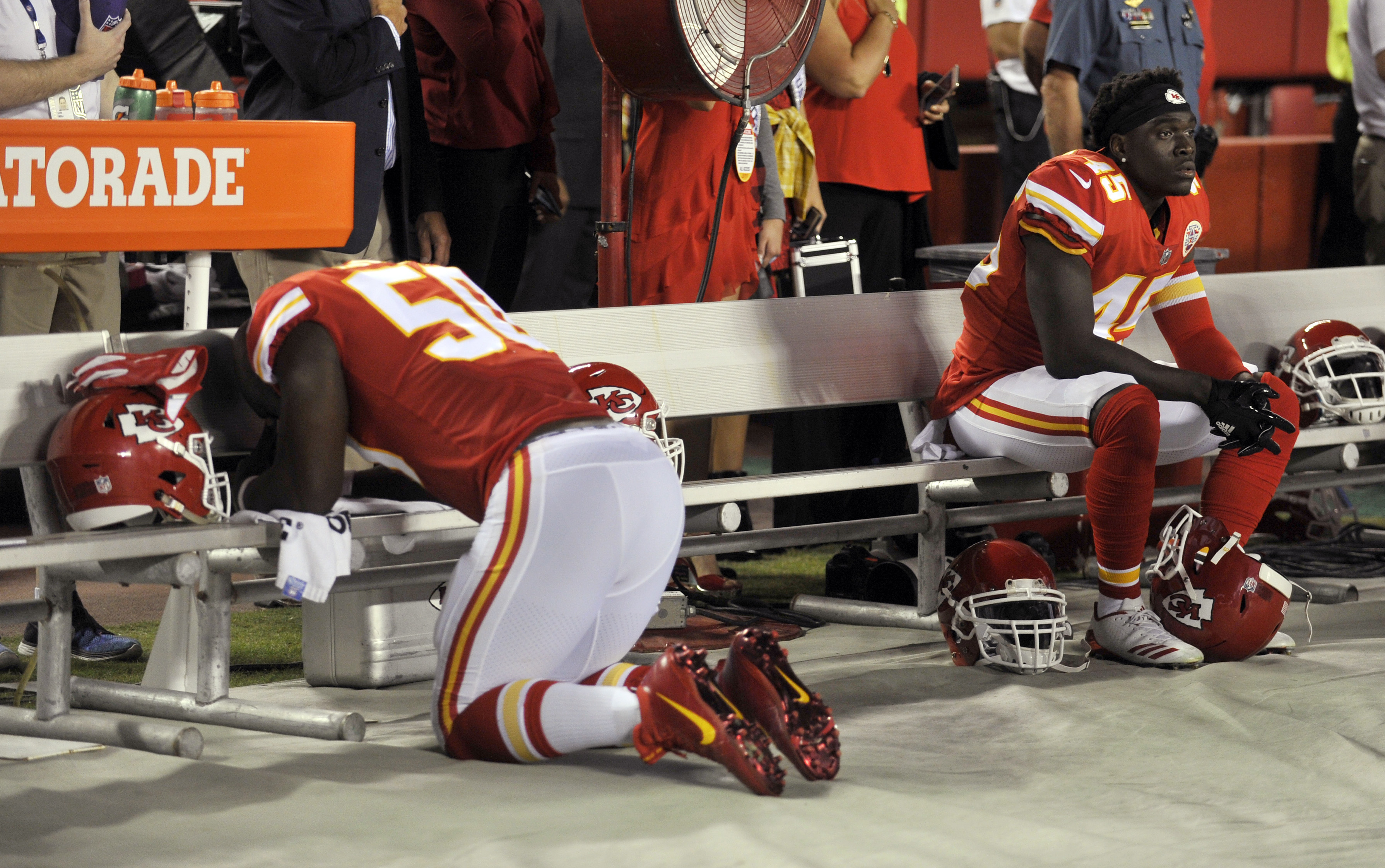 Kansas City Chiefs linebacker Justin Houston kneels during the national anthem before an NFL game.