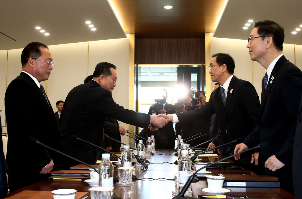 South Korea Unification Minister Cho Myung-Gyun shakes hands with North Korean chief delegate Ri Son-Gwon during their meeting at the border truce village of Panmunjom.