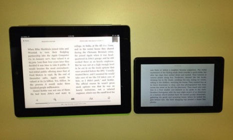 The Kindle Fire (right) next to the iPad