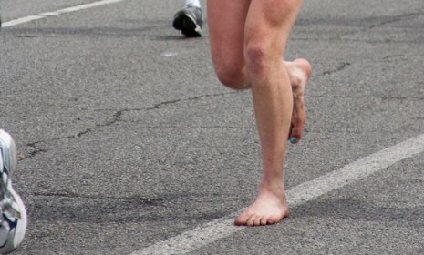A barefoot runner hits the pavement during the Los Angeles marathon this year.