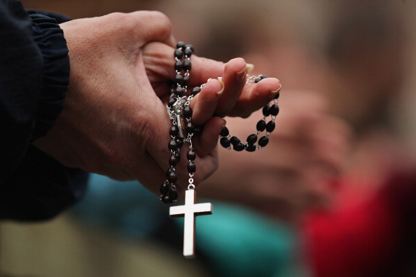 Holding a rosary