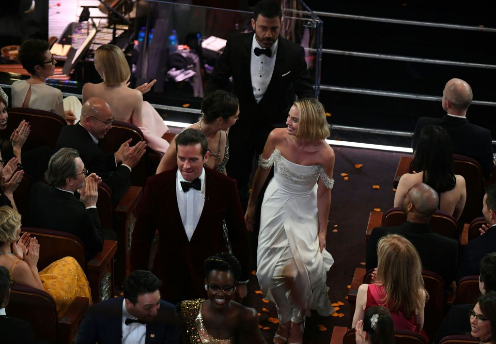 Celebrities leave the Oscars.
