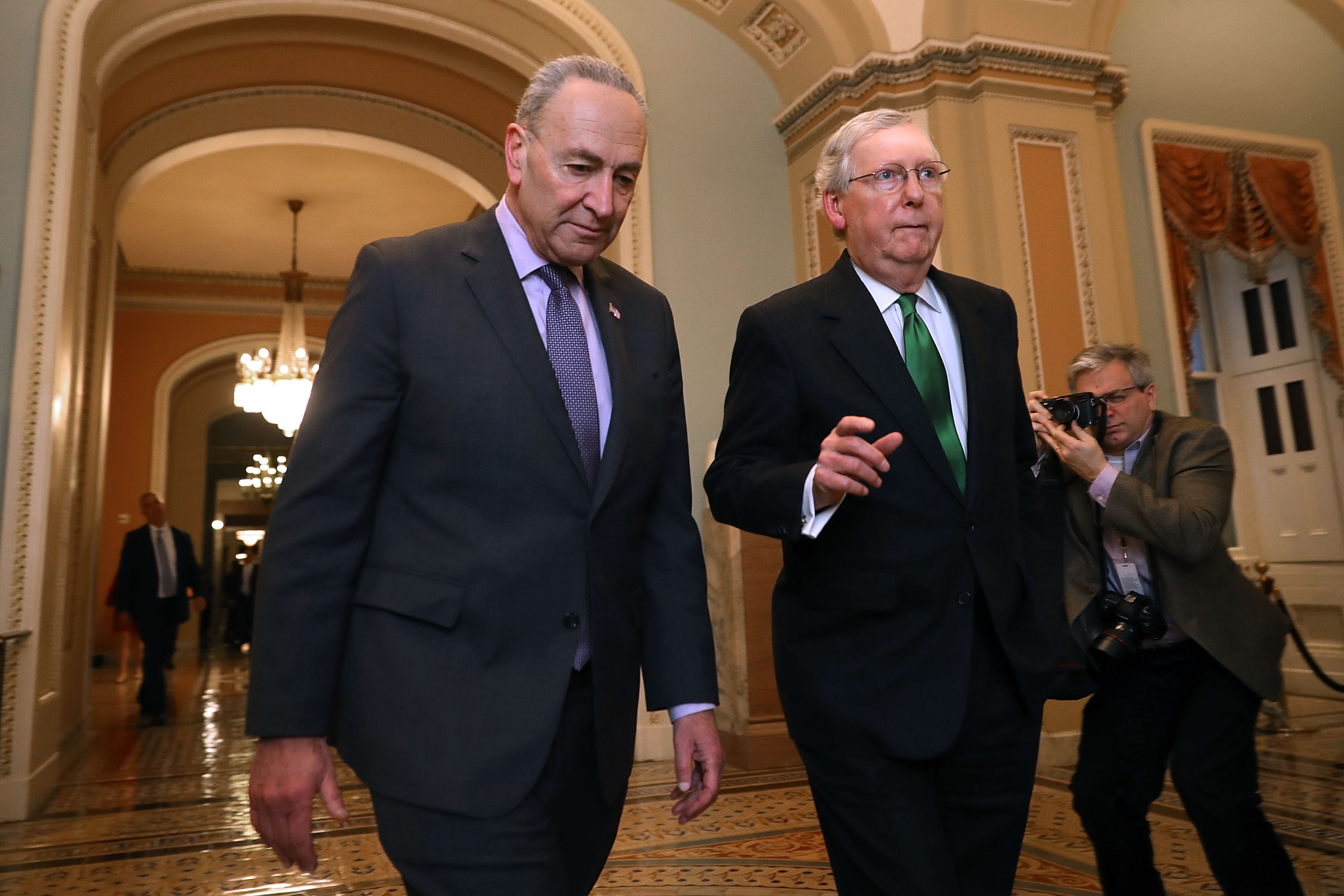 Chuck Schumer and Mitch McConnell walk side-by-side