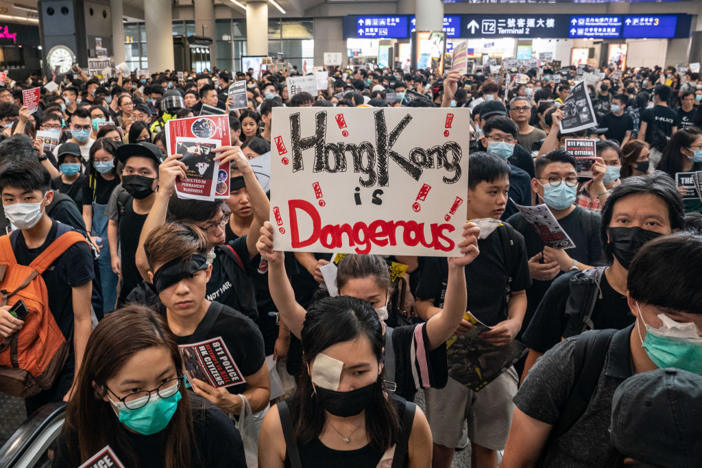 Protesters bring Hong Kong airport to a halt