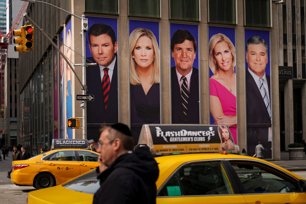 Fox News hosts on posters.