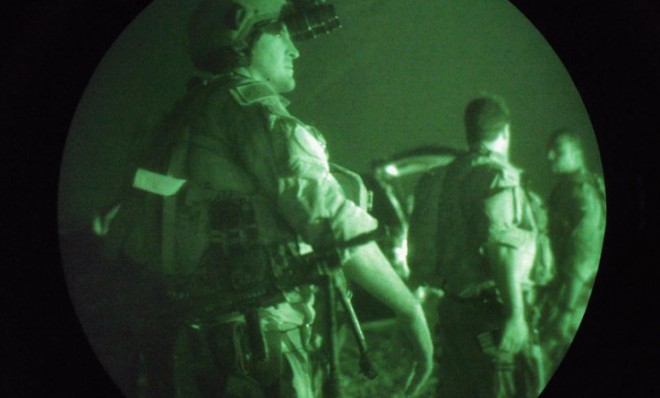 Navy SEALs prepare for a night mission in Iraq in 2007. 