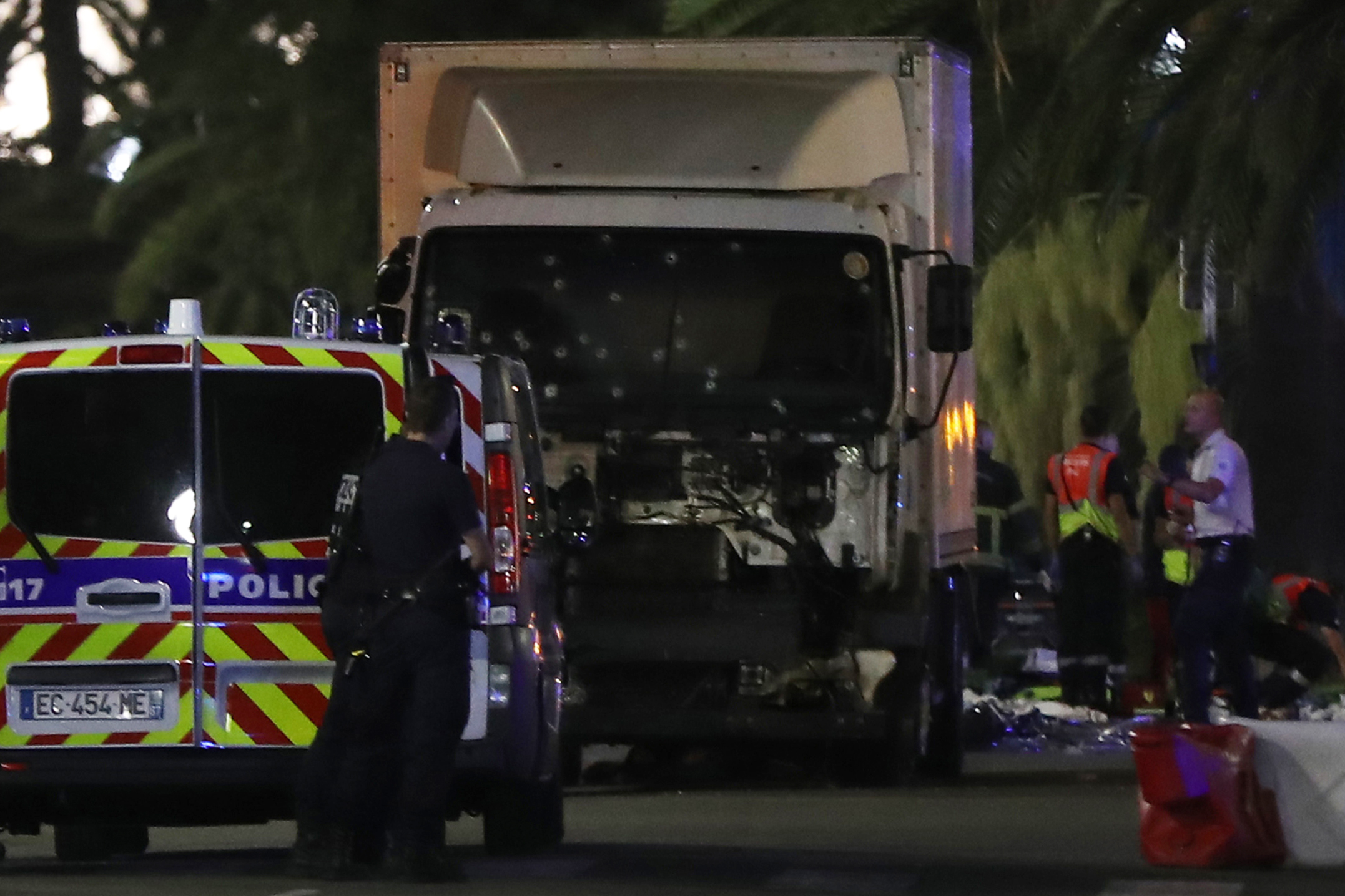 Bullet holes pockmark the truck used in the Nice attack.