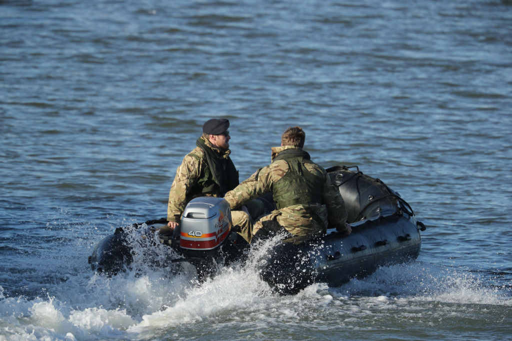 A Royal Navy bomb disposal team investigating after unexploded bomb found in Thames.