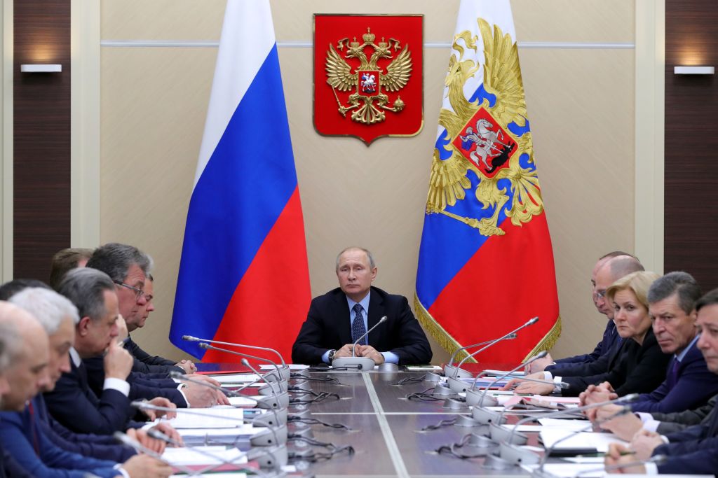 Russian President Vladimir Putin in a meeting.
