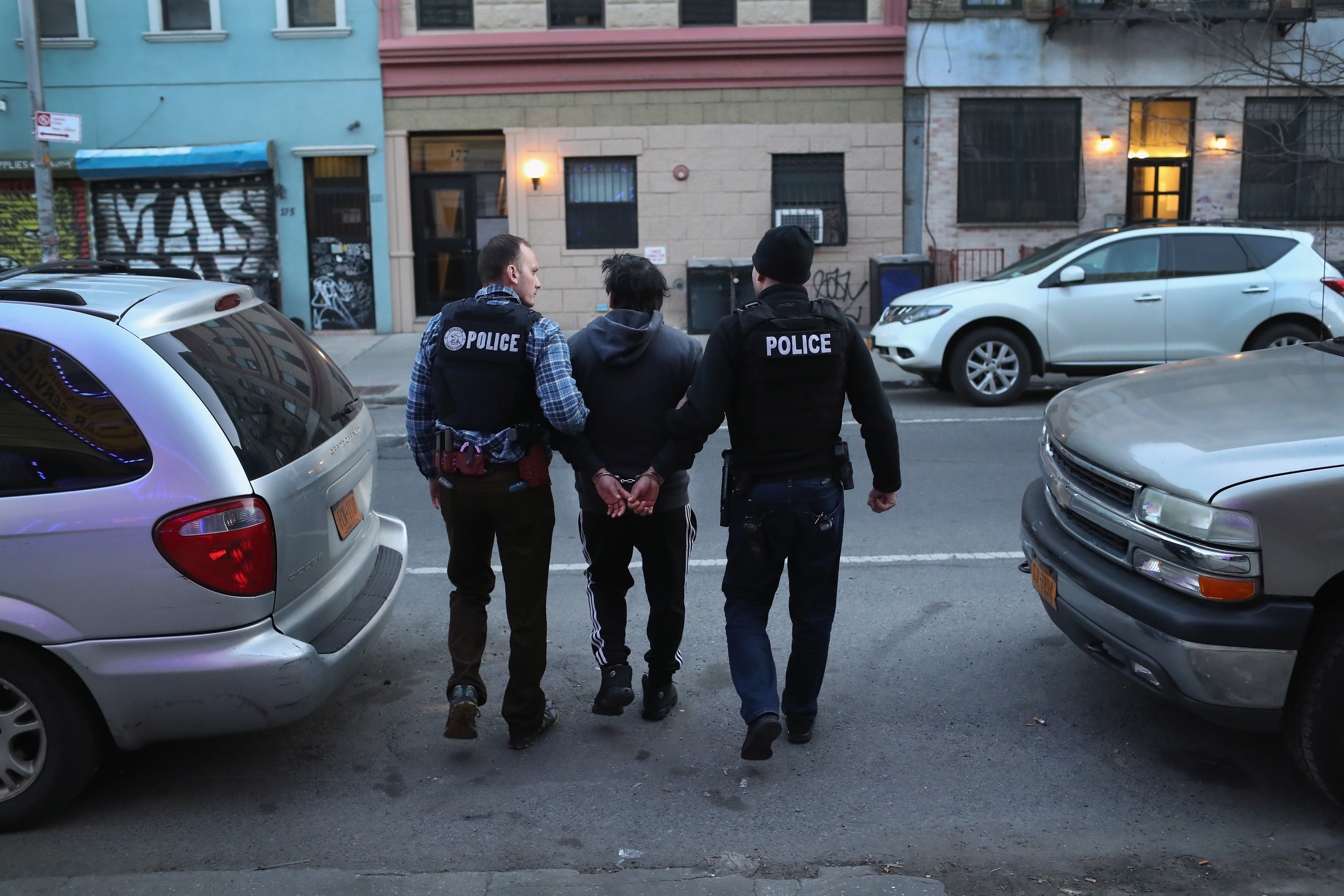 ICE officers arrest an undocumented immigrant.