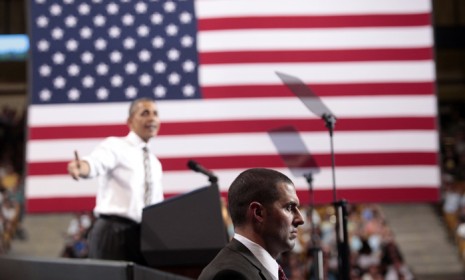 A member of the Secret Service stands watch while President Obama speaks at the University of Colorado at Boulder Tuesday.