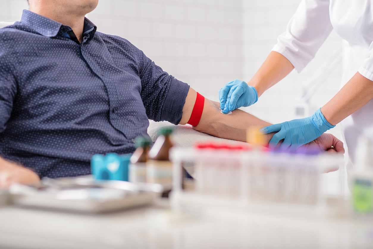 A man prepares to donate blood.