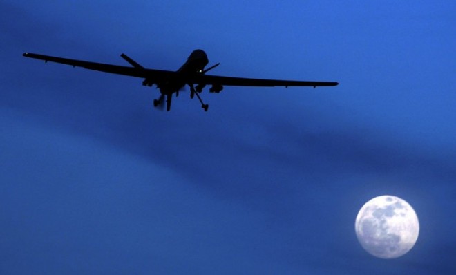 In this 2010 file photo an unmanned U.S. Predator drone flies over Kandahar Air Field, southern Afghanistan. 