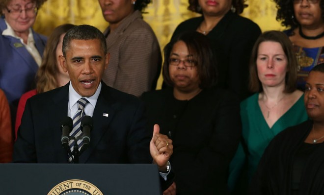 President Barack Obama speaks in front of relatives of gun violence victims on March 28, 2013 in Washington. Obama urged Congress to pass measures such as background checks to protect childre
