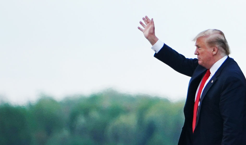 Trump waves on his way to Mar-a-Lago