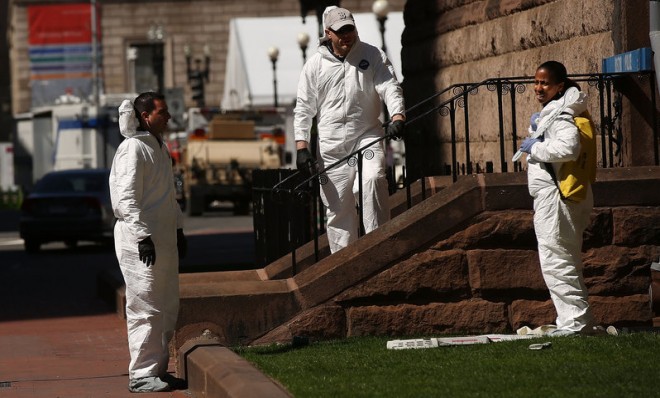 Members of the FBI search for clues on April 17 near the scene of the bombings at the Boston Marathon.
