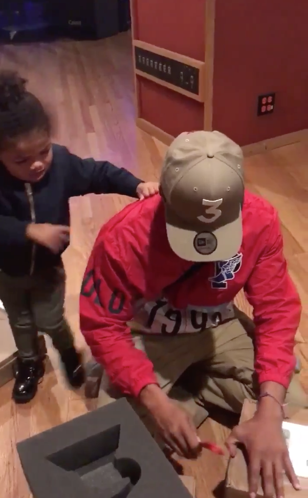 Chance the Rapper and daughter.