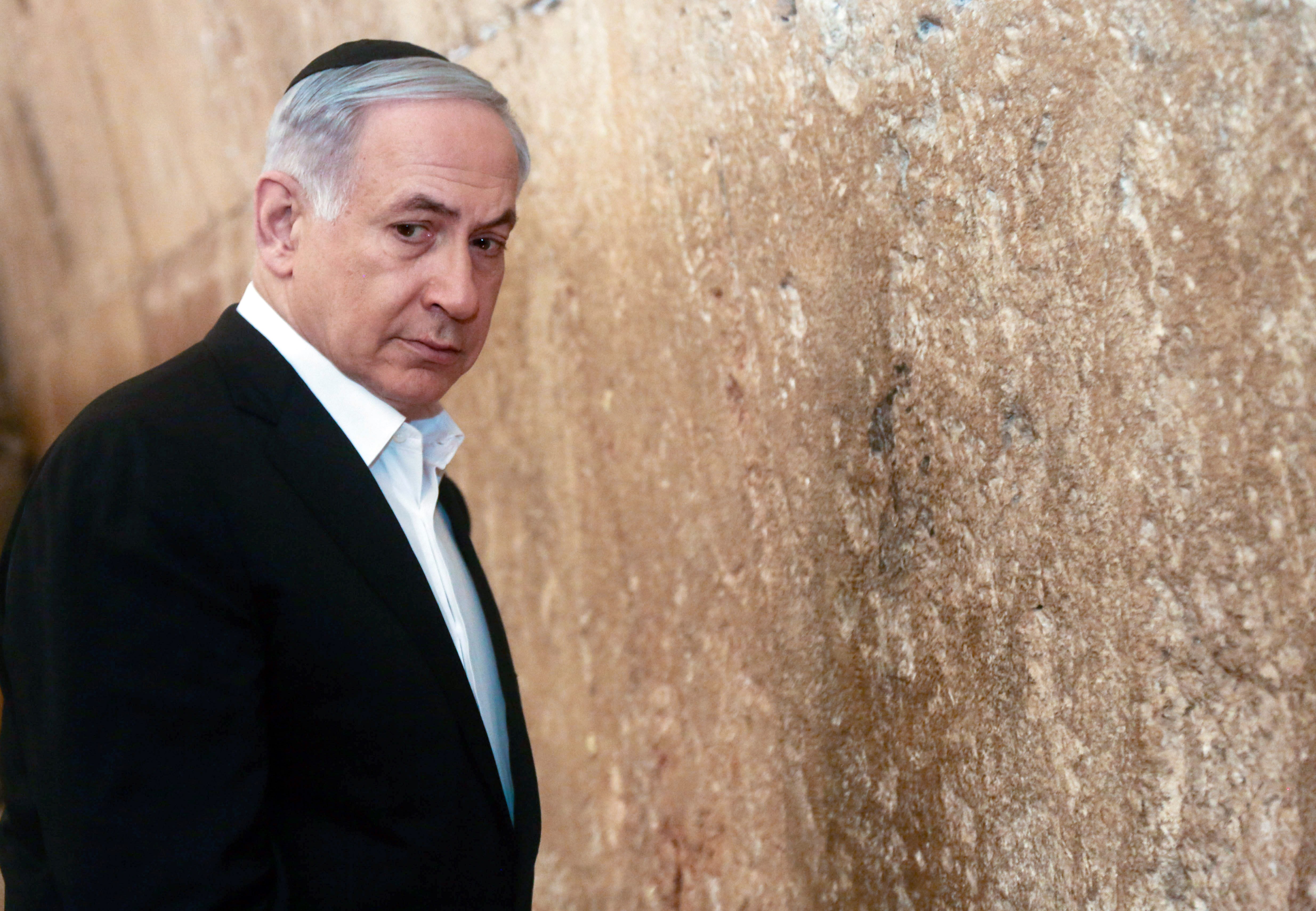 Israeli Prime Minister Bejamin Netanyahu stands before the Western Wall in Jerusalem.