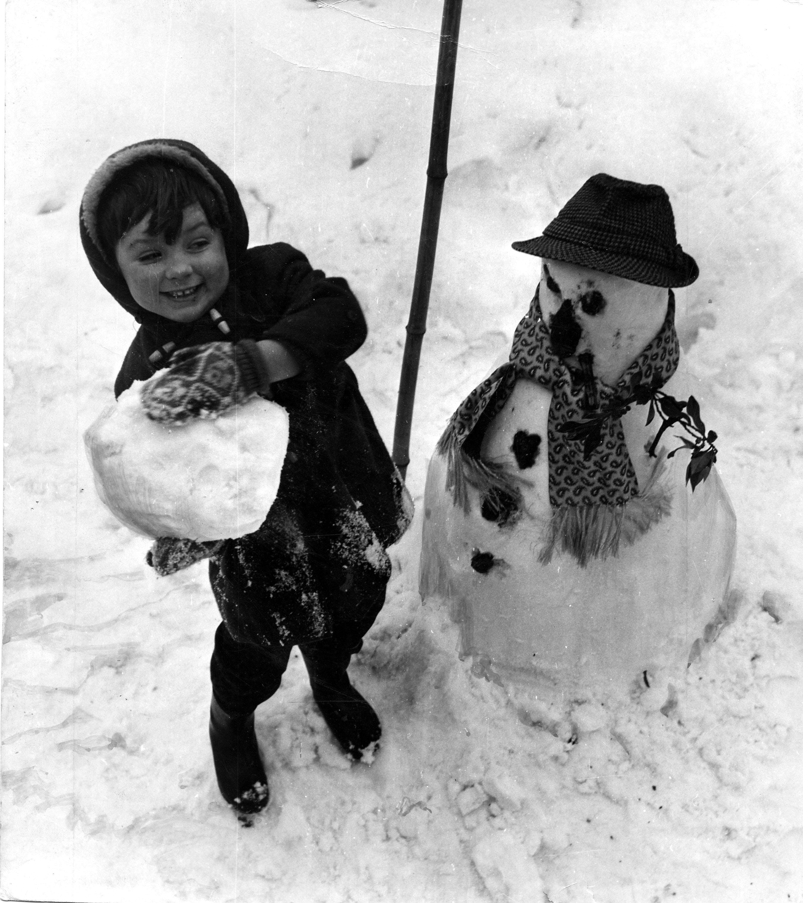A boy and his frosty pal. 