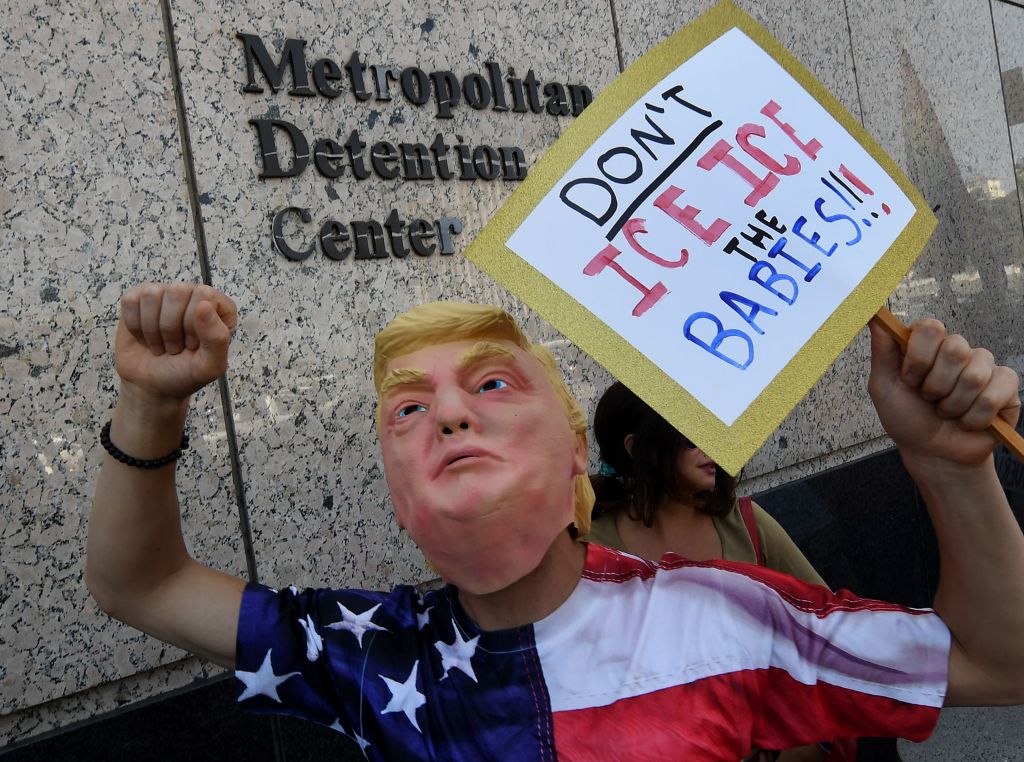 A protester rails against Trump immigration policies
