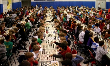 Grade-school kids play in a Minnesota chess tournament: In Armenia, all students will be required to take chess lessons to improve their critical thinking skills.