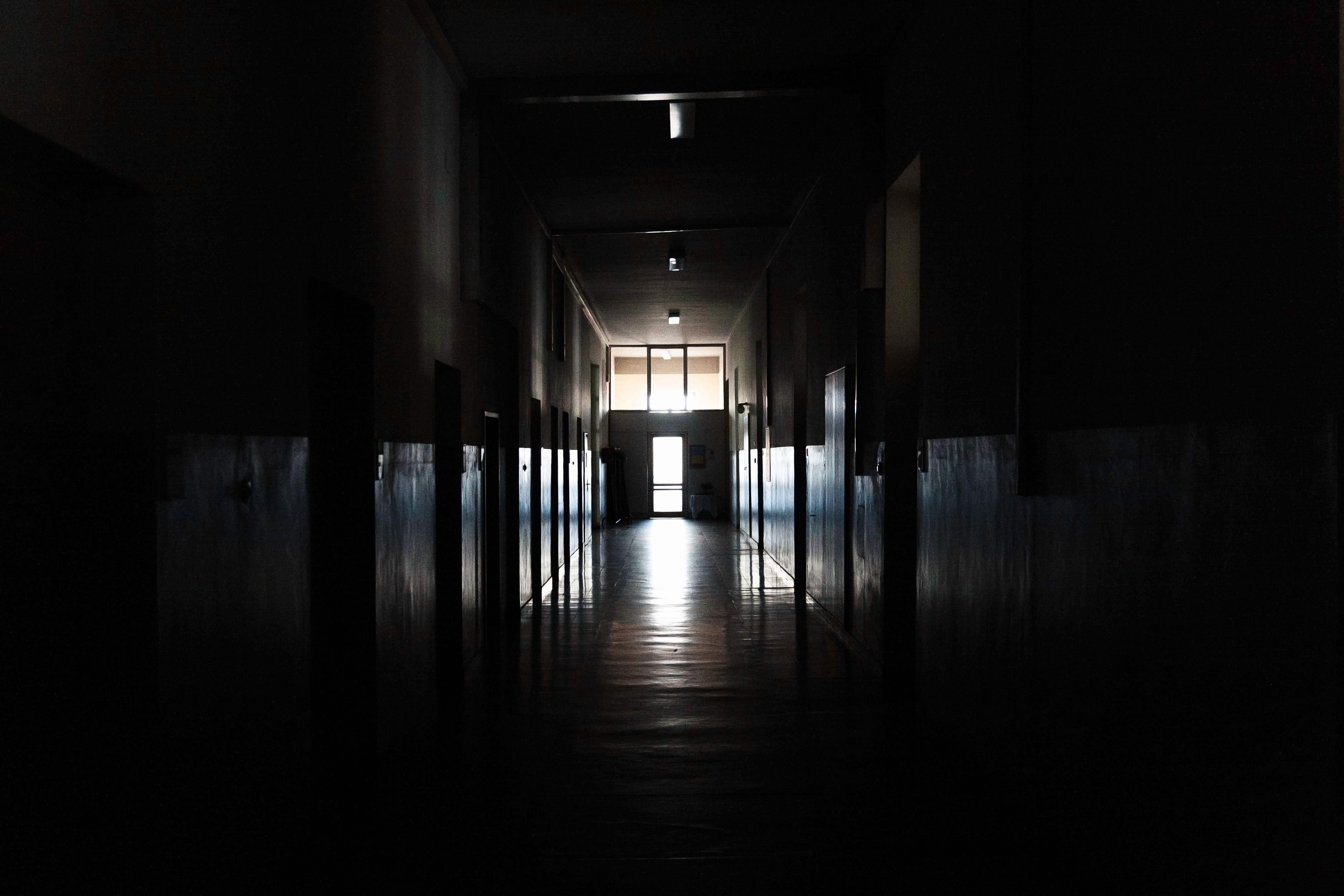 A dark school hallway.