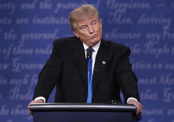 Donald Trump reacts to Hillary Clinton at the presidential debate.