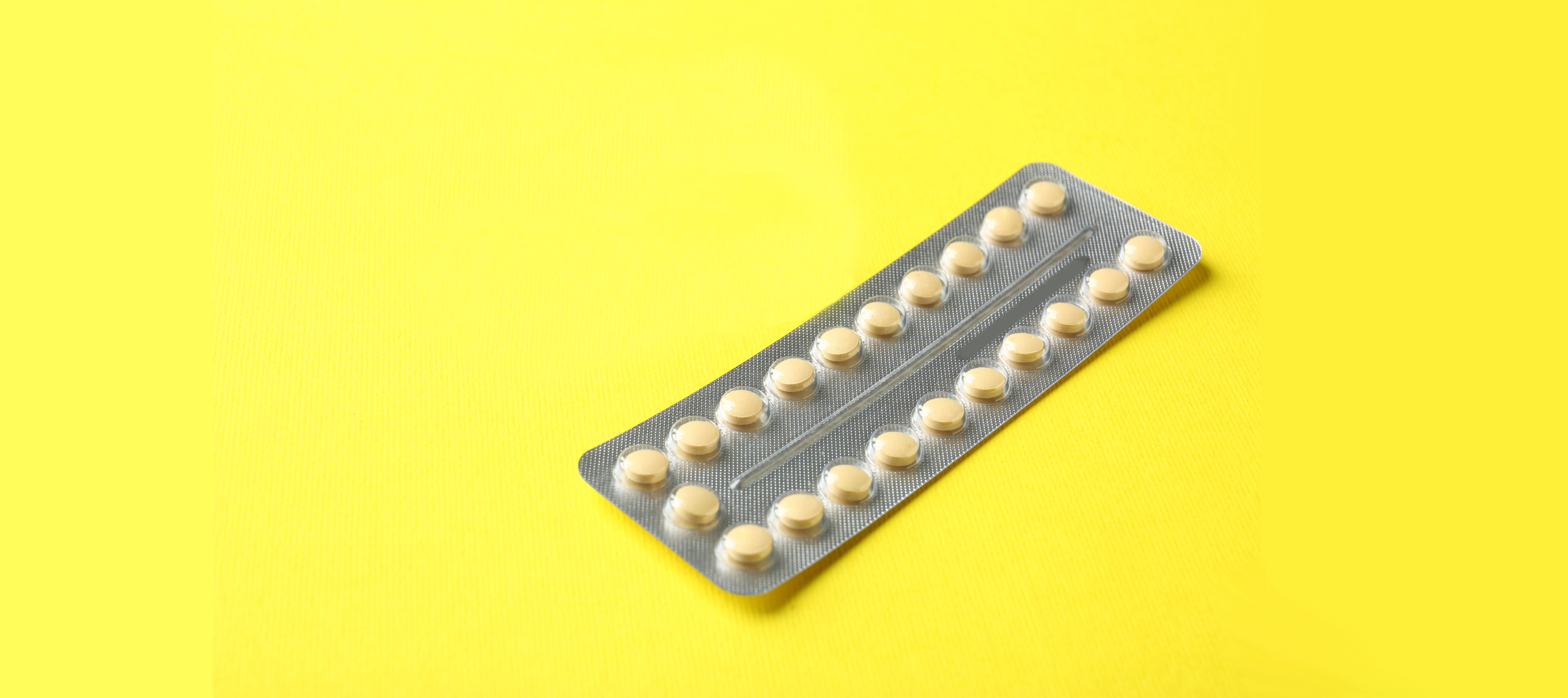 Birth control pills sit on a table