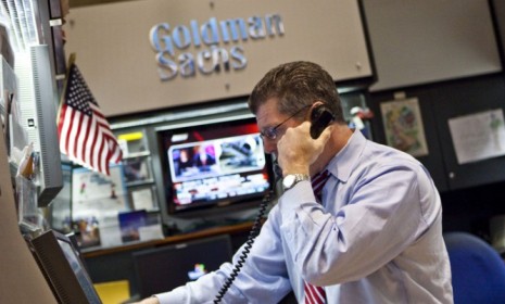 A Goldman Sachs trader on the New York Stock Exchange Floor