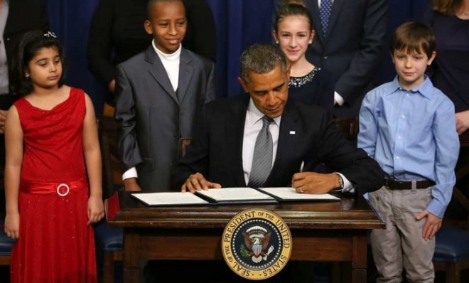President Obama signs an executive order on gun control on Jan. 16