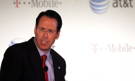 AT&amp;T CEO Randall Stephenson announces Sunday that the wireless giant will buy rival T-Mobile, which means the latter&#039;s customers will get the iPhone... eventually. 