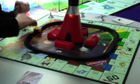 The new Monopoly swaps money, dice and cards for an all-knowing computer tower that tells players what to do and when to do it.