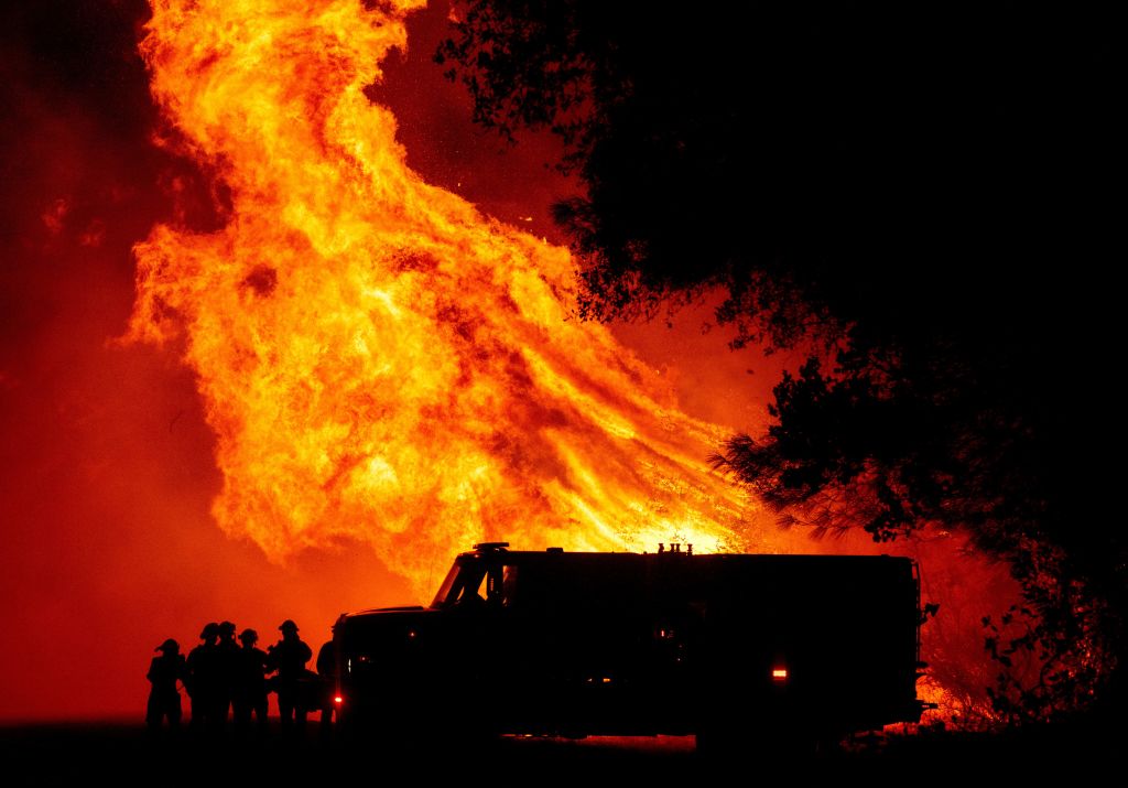 Flames shoot up near firefighters in Northern California.