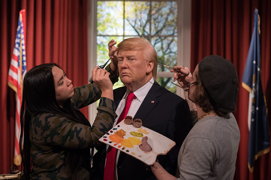 Artists put the finishing touches on a Donald Trump wax figure.