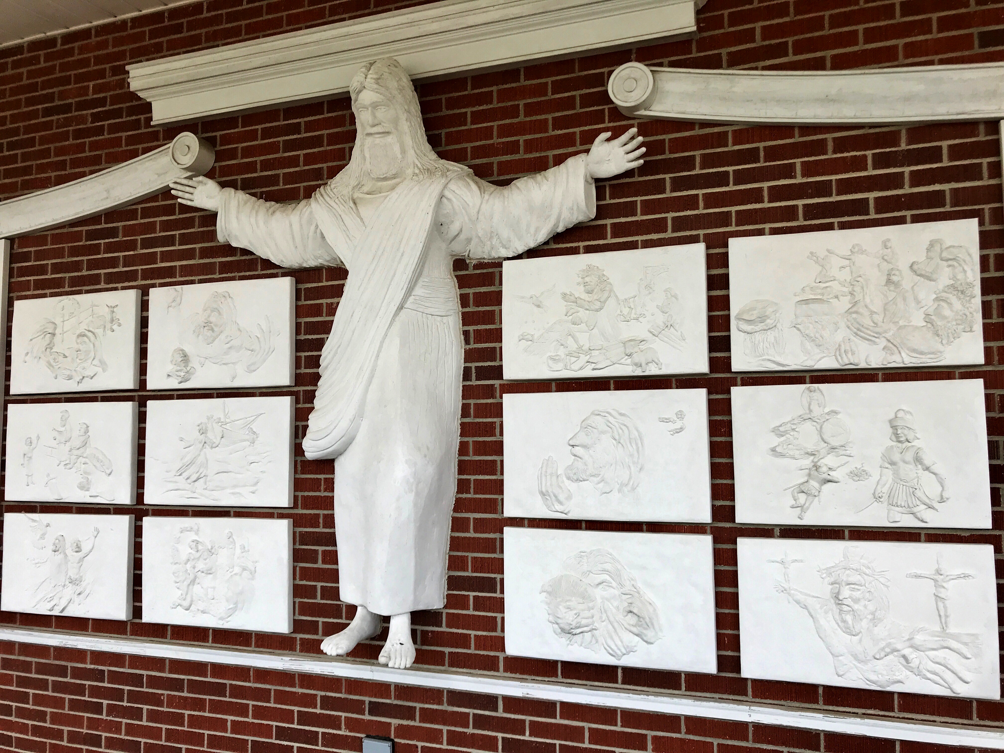 The Jesus statue and reliefs outside of Red Bank Baptist Church in Lexington, South Carolina.