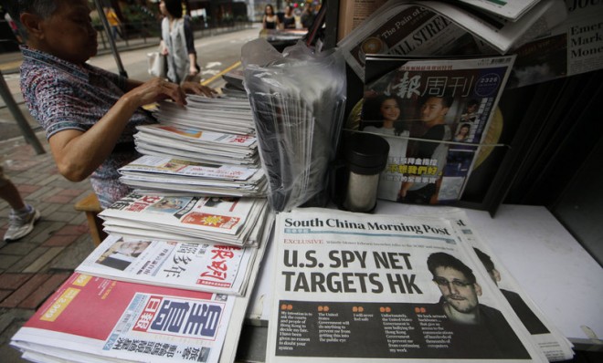 The front page of South China Morning Post is displayed at a news stand in Hong Kong on June 13. 