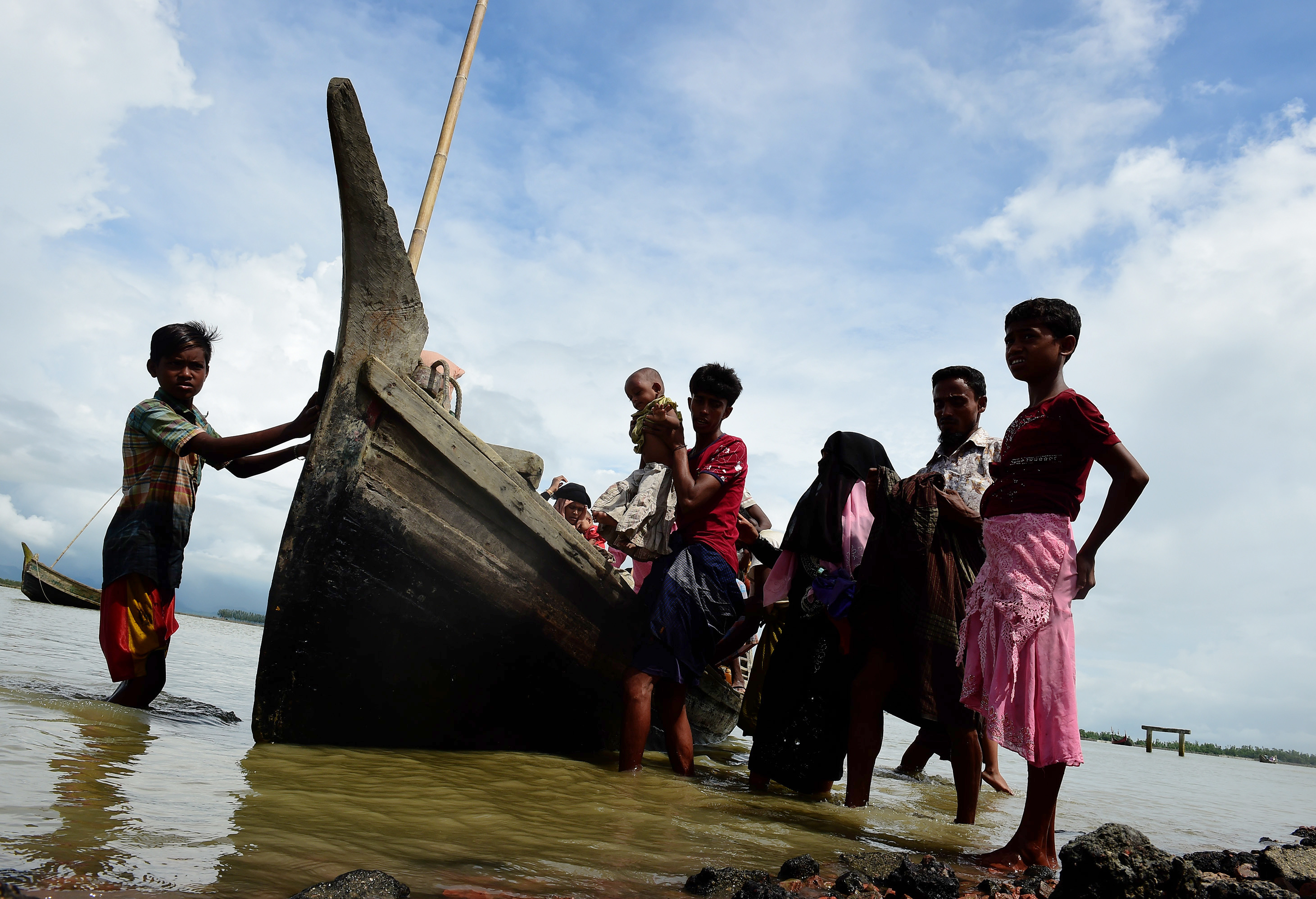 Rohingya refugees flee to Bangladesh. 