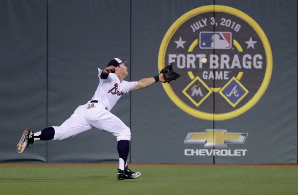 Chase d&#039;Arnaud of the Atlanta Braves dives for a ball during the game Sunday at Fort Bragg.