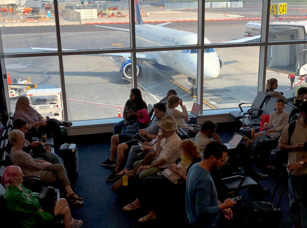 Airline passengers wait for their flights