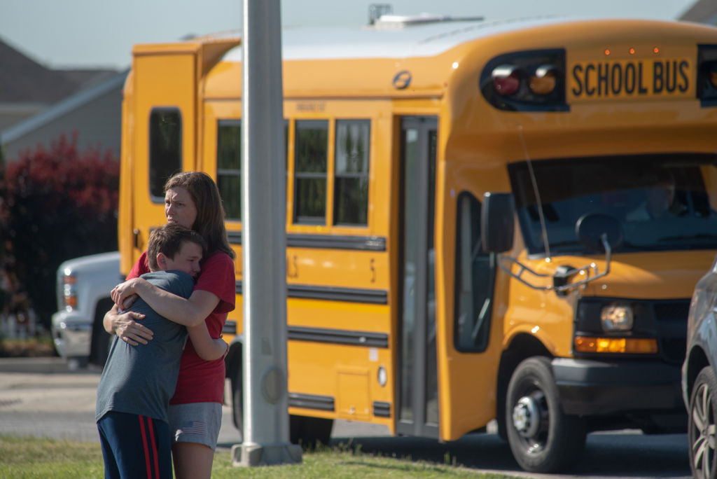  A student and adult embrace outside Noblesville West Middle School after a shooting at the school on May 25, 2018 in Noblesville, Indiana. 