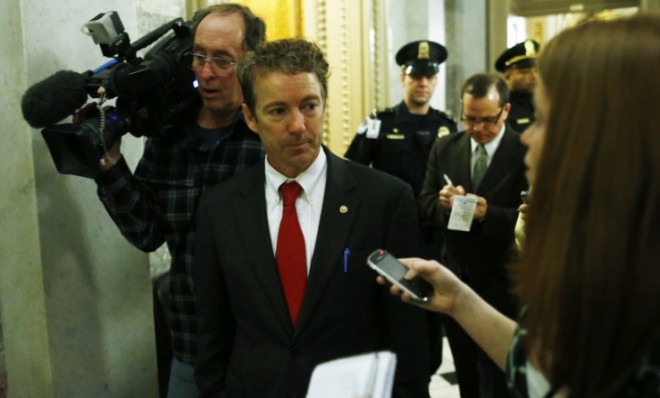 Sen. Rand Paul (R-Ky.) walks off the floor of the Senate after his filibuster. 