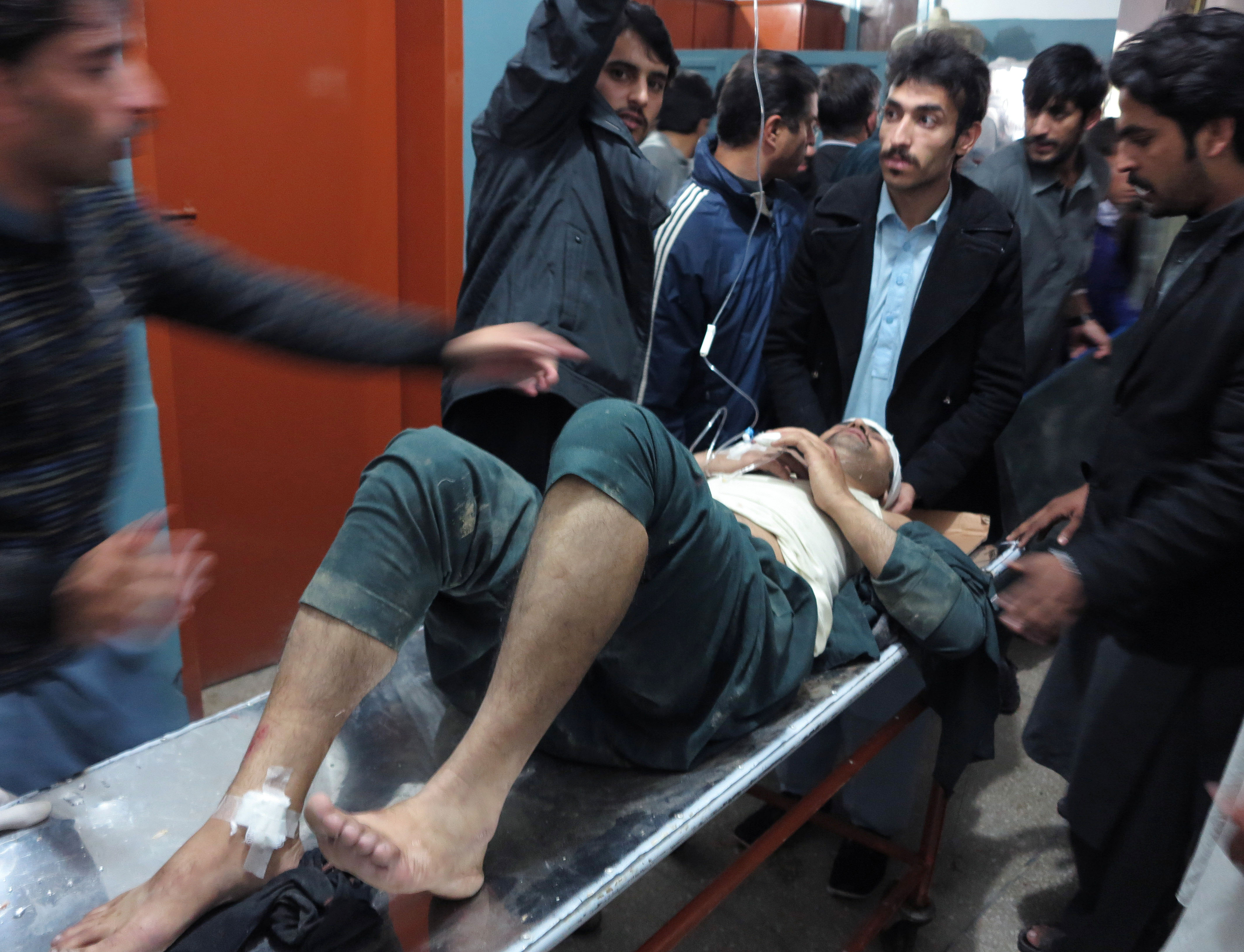 A patient is hauled into a hospital in Pakistan.