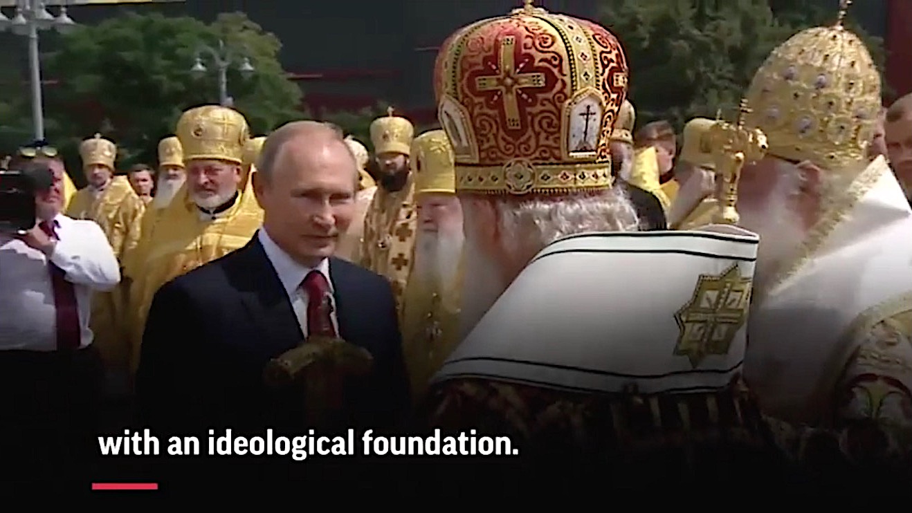 Russian President Vladimir Putin converses with Russian Orthodox leaders