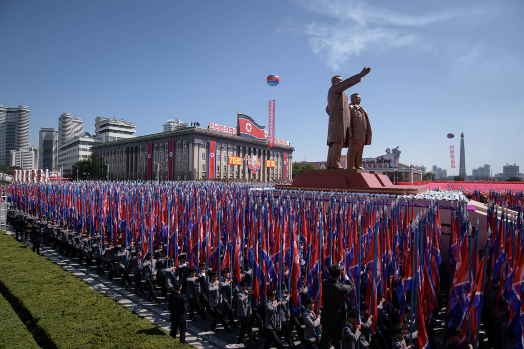 Students march past a balcony from where North Korea&#039;s leader Kim Jong Un was watching, during a mass rally on Kim Il Sung square in Pyongyang on September 9, 2018. 